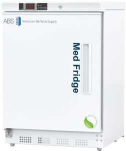 A white 4.6 cu. ft. ADA compliant pharmacy refrigerator labeled Med Fridge in blue text on the door, with American BioTech Supply and ABS logo on the top left. A small digital display and control panel are at the top. A green leaf emblem is near the bottom right corner.