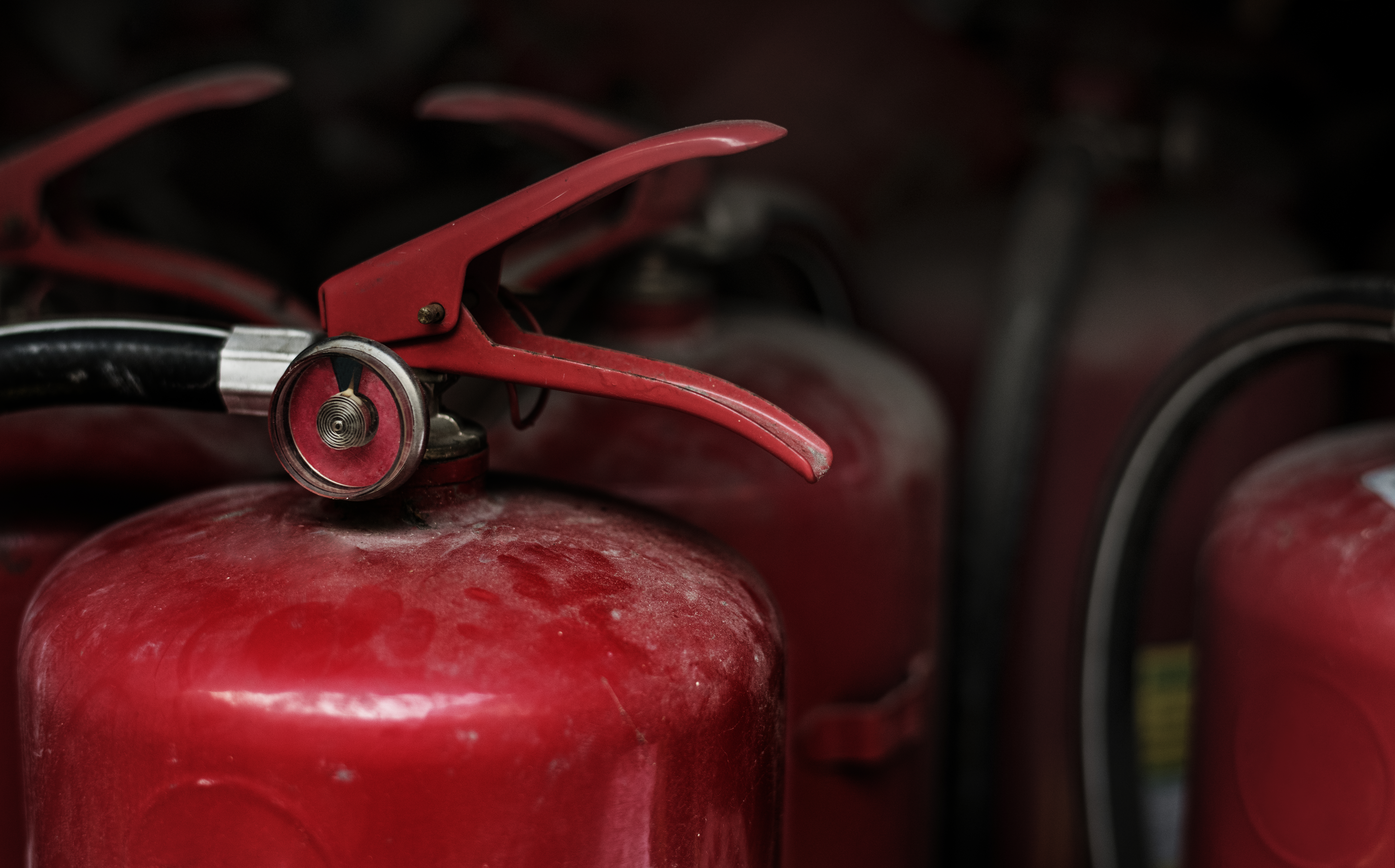 closeup-of-red-fire-extinguishers