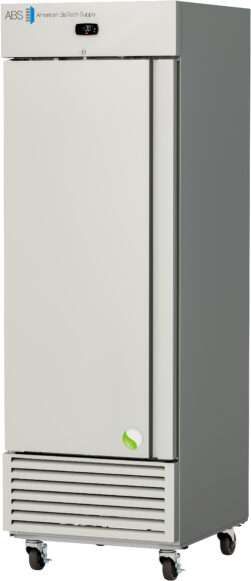 A tall, single-door, gray and white medical refrigerator from American BioTech Supply stands on four wheels. A small digital temperature display is above the door, and ventilation slats are at the bottom front. The door has a subtle green leaf logo near the base, for this model, a 25 cu ft -30°C stainless steel laboratory freezer.