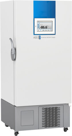 A tall, white ultra low temperature freezer with a blue vertical stripe on top. A digital display on the front shows -86.6°C. The unit features a left-side handle, ventilation grilles at the base, and is labeled “ABS American BioTech Supply.”