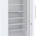 Upright hazardous location refrigerator, door open, shelves showing