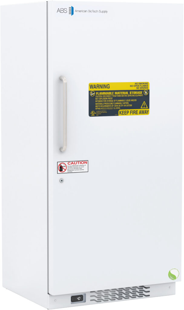 A white upright Standard Flammable Storage Refrigerator with a solid door, vertical left-side handle, and multiple warning labels, including yellow and red signs. Features a vent at the bottom and the American BioTech Supply logo at the top.