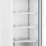 A tall, white laboratory refrigerator with a glass door, digital temperature display, four adjustable metal shelves, side handle, ventilation grill at the bottom, and four wheels for mobility. The interior is empty and well-lit.