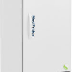 A tall, white medical refrigerator on wheels labeled Med Fridge. It has a digital temperature display at the top, a vertical handle on the right side, ventilation panels at the bottom, and a green circular sticker near the lower right corner.