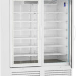 A large, white laboratory refrigerator on wheels with two glass sliding doors, empty adjustable shelves, a digital temperature display at the top, and ventilation grilles at the bottom. The brand American Biotech Supply appears on the upper left.