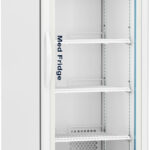 A tall, white medical refrigerator with a glass door displays five empty shelves. The digital display at the top shows a temperature of 2.4°C. “Medi Fridge” is written inside. The fridge is on wheels and has vents near the bottom.
