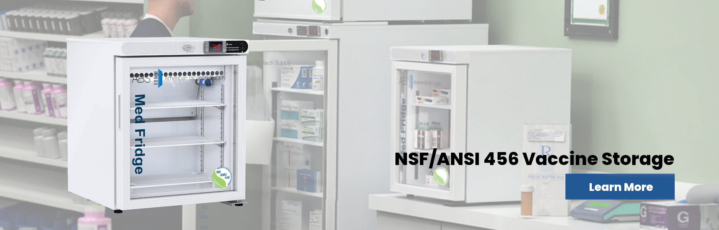 A white medical refrigerator labeled Med Fridge is prominently displayed in a pharmacy setting, with shelves inside visible. In the background, other medical refrigerators and shelves with medications are visible. Text reads “NSF/ANSI 456 Vaccine Storage” and a Learn More button.