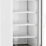 A tall, white, upright laboratory refrigerator with a glass door, five wire shelves, a digital temperature display showing 4.0°C, and ventilation grilles at the top and bottom. The door is open, revealing the empty shelves inside.