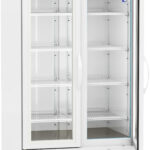 A commercial laboratory refrigerator with two transparent glass doors, white exterior, and digital temperature display reading 4.0°C. Inside are several adjustable white wire shelves. The unit is on wheels and has vented panels at the bottom.