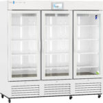 A large, white, three-door medical refrigerator with glass doors, interior shelves, a digital temperature display showing 4.0°C, and ventilation grills at the bottom. The refrigerator is empty and stands on wheels for mobility.
