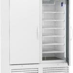 A large white medical refrigerator with a digital temperature display, glass sliding door, and multiple empty wire shelves inside. The refrigerator is on wheels and has a ventilation panel at the bottom. The brand label ABS is on the top left.
