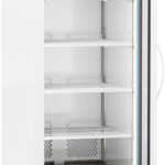 A tall, white medical refrigerator labeled ABS stands on small wheels with a transparent glass door open to reveal five empty wire shelves, a side light, a digital temperature display showing 4°C, and a vented panel at the bottom front.
