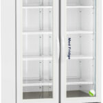 A tall, white, double-door medical refrigerator with glass doors, labeled Med Fridge. It has a digital temperature display at the top, several adjustable wire shelves inside, and ventilation panels at the bottom. The fridge is on wheels.