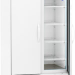 A tall, white lab refrigerator with a glass door on the right showing empty wire shelves, a digital temperature display reading 4.0°C, and ventilation grills at the bottom. The left door is solid and closed; the unit is on wheels.