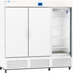 A large, white, commercial refrigerator with three doors; the right door is open, revealing five empty wire shelves. The fridge has a digital control panel at the top center and is mounted on rolling casters. The brand ABS is visible on the upper left.