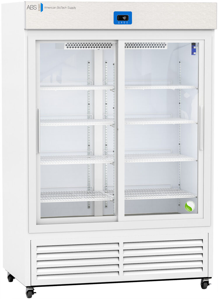 White commercial refrigerator with glass sliding doors, four wire shelves inside, a digital temperature display at the top, and ventilation grilles at the bottom. The unit is on wheels and labeled “American BioTech Supply” in the top left corner.