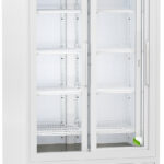 A large, white, upright laboratory refrigerator with glass sliding doors, multiple adjustable wire shelves, a digital display panel on top, and vents at the bottom. The unit is empty and stands on casters for mobility.