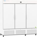 A large, white commercial refrigerator with three doors, vertical handles, and vented panels at the bottom, standing on wheels. The top section displays a digital temperature screen and a brand logo in the left corner.