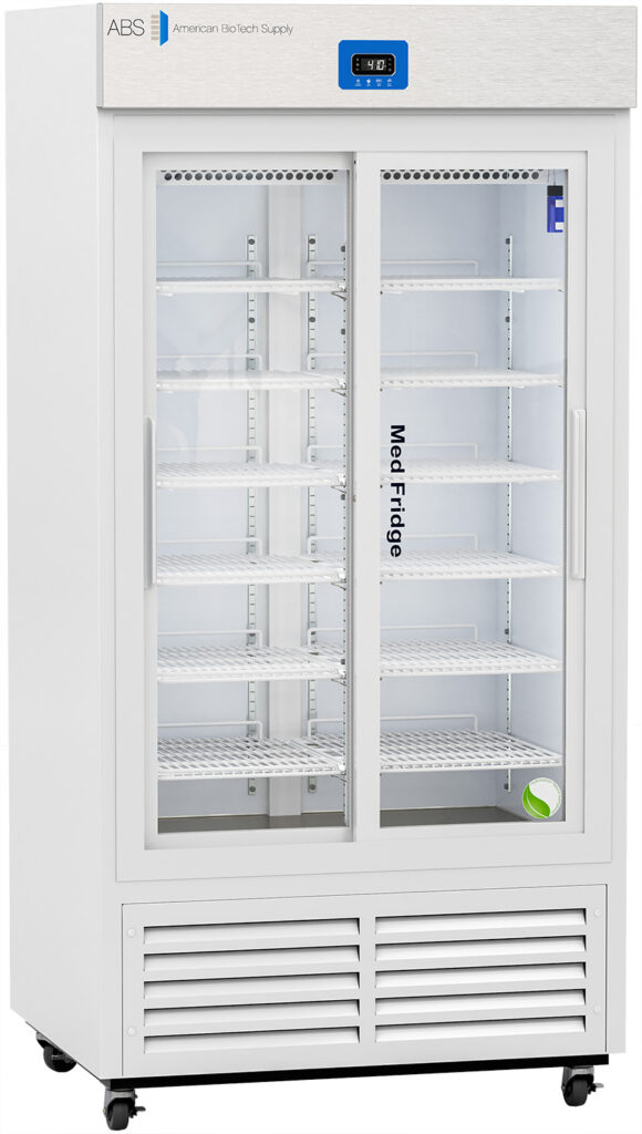 A tall, white commercial refrigerator with glass sliding doors, labeled “Med Fridge.” It has multiple adjustable wire shelves inside, a digital display at the top, and ventilation slots at the bottom. The unit is on wheels for easy movement.