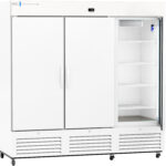 Large, white commercial refrigerator on wheels with three vertical doors; the right door is open, revealing empty adjustable shelves inside. A digital temperature display is centered above the doors, and vents run along the bottom.