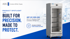 A tall, stainless steel laboratory refrigerator with glass door stands open in a modern lab setting. Beside it, text reads: Built for precision. Made to protect. ABT-HC-SSR-25G, 25 cu. ft. stainless steel laboratory refrigerator. Reliable storage. Every degree matters.