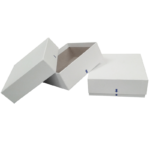 Two plain white rectangular cardboard boxes are shown. One box is closed and laying flat, while the other has its lid off and leaning to the side, revealing the empty interior. Both boxes have a small blue arrow symbol on the front side. The background is white.