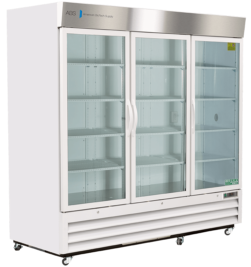 A large, white commercial refrigerator with three clear glass doors, vertical handles, metal trim, and interior shelves. The refrigerator is empty and on wheels, with ventilation grilles at the bottom and a logo on the top left corner.