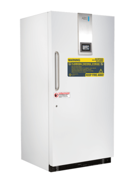 A tall, white TempLog Premier Flammable Storage Freezer features a vertical handle on the left, a digital temperature display on top, and multiple warning labels such as “Flammable Material Storage” and “Keep Fire Away.” The closed unit stands alone.