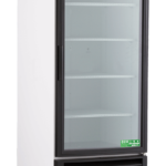 A tall, white commercial refrigerator with a glass door, black trim, and four shelves inside. It has a digital display panel at the top, ventilation grill at the bottom, and stands on four wheels. The door displays eco-friendly certification labels.
