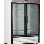 A large white Premier Glass Door Laboratory Refrigerator with two glass doors, black framing, and multiple empty shelves. It features a digital temperature display, ventilation grilles at the bottom, and small wheels for mobility.