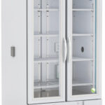 A tall, white, double-door laboratory refrigerator with glass doors, metal shelves, and a digital temperature display on top. The interior is empty, and the unit is mounted on caster wheels for mobility.