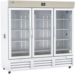 A large, white, three-door laboratory refrigerator with glass doors and metal shelves. The digital temperature display is above the center door. Shelves inside are empty, and interior LED lights illuminate the unit. Vents are located along the bottom front.