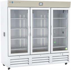 A large, three-door commercial refrigerator with glass doors displays empty metal shelves inside. The unit is white with a beige top panel, featuring a digital temperature display and the AES brand logo in the upper left corner.