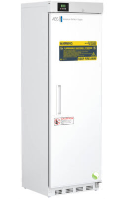 Tall, white laboratory refrigerator with a digital display on top, labeled “American BioTech Supply.” Warning labels indicate flammable material storage and a “Keep Fire Away” sign. A handle runs vertically on the right side of the door.