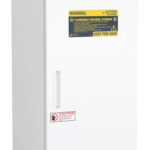 A tall, white laboratory refrigerator with a digital display on top, labeled “ABS American BioTech Supply.” The door has yellow and red warning labels stating, “Flammable Material Storage” and “Keep Fire Away,” as well as a caution notice near the handle.