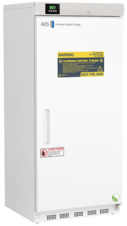 A tall, white laboratory freezer from American BioTech Supply with a solid door, digital display, caution stickers, and a large yellow warning label about flammable material storage. The unit stands on small legs and has a recessed handle on the door.
