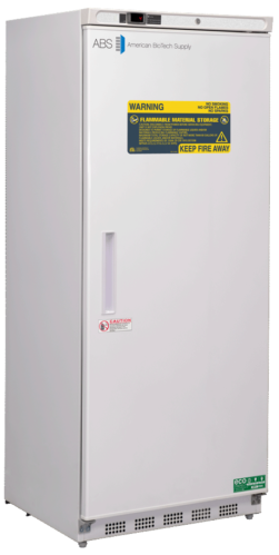 A tall, white upright NFPA compliant refrigerator with a digital display at the top, labeled American BioTech Supply. Warning labels for flammable material storage are visible on the door, which has a vertical handle and a caution sticker.