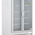 A commercial, upright, white refrigerator on wheels with two clear glass swing doors, metal handles, and multiple adjustable shelves inside. The top has a silver control panel with a digital display, and the bottom features ventilation grilles.