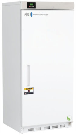 A tall, white laboratory freezer with a digital temperature display on top, labeled ABS American BioTech Supply. The door has a handle, a caution sticker, and a circular green certification mark near the bottom. The surface is clean and unadorned.