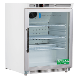 A white laboratory refrigerator with a glass front door, three metal shelves, a digital temperature display, and ventilation grilles at the bottom. The door features American BioTech Supply branding and eco-friendly stickers in the lower right corner.