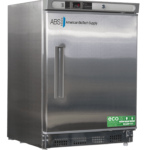 A stainless steel laboratory refrigerator with a front door handle, digital temperature display, and ABS American BioTech Supply logo. The bottom has vents, and a green ECO Friendly sticker is on the lower right corner of the door.