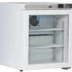 A small, white laboratory refrigerator with a glass door shows two adjustable shelves, a cooling fan, and a digital temperature display set at 4°C. The label American BioTech Supply is visible on the glass door.