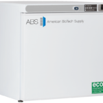 A white chest freezer with the logo “ABS American BioTech Supply” on the front. The top has a digital temperature display and controls. A green sticker indicates it is eco-friendly and HFC-free. The lid has a handle, and the freezer stands on black feet.