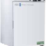 A white upright laboratory refrigerator by American BioTech Supply ABS with a digital temperature display, side handle, and green eco-friendly label on the bottom right corner of the door. The unit appears clean and modern.