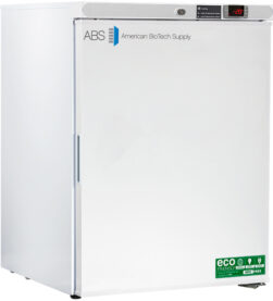 A white upright medical freezer labeled ABS American BioTech Supply, with a digital temperature display showing -20°C, a handle on the left, and eco-friendly certification stickers on the bottom right of the door.