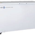 A large white General Purpose Manual Defrost Chest Freezer with a flat lid, four black caster wheels, and the ABS American BioTech Supply logo on the front. A small circular sticker sits in the top right corner; the smooth surface is clean.