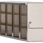 A rectangular metal storage container with five vertical compartments and shelves. The front has a closed door with a horizontal handle. The container appears industrial, possibly used for organizing tools or supplies.