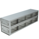 Rectangular metal storage organizer with two rows of three open cubbies each. The unit has handles on both sides and is silver in color. The background is plain white, highlighting the organizer’s structure and compartments.