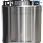 A large, cylindrical stainless steel tank with a digital control panel on top, labeled ABS American BioTech Supply. The tank has wheels at the base for mobility and various valves and fittings attached, indicating it is used for scientific or biotechnological storage.