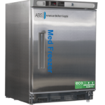 A stainless steel 4.2 cu. ft. undercounter stainless steel pharmacy freezer with a solid front door labeled Med Freezer in blue. It displays the brand American BioTech Supply and eco-friendly stickers. The freezer has a digital temperature display and a rectangular handle on the left side of the door.